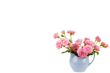 Naklejka na ściany i meble Pink flowers in blue jug.