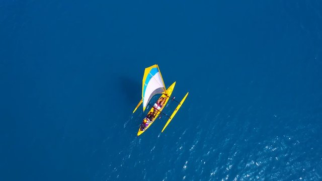 Aerial footage - Catamaran powered by Paddles and wind at sea