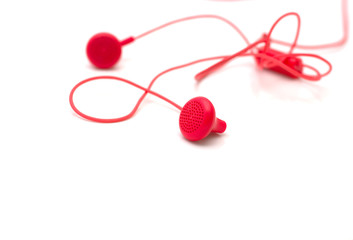 red earphones on white background isolated with path