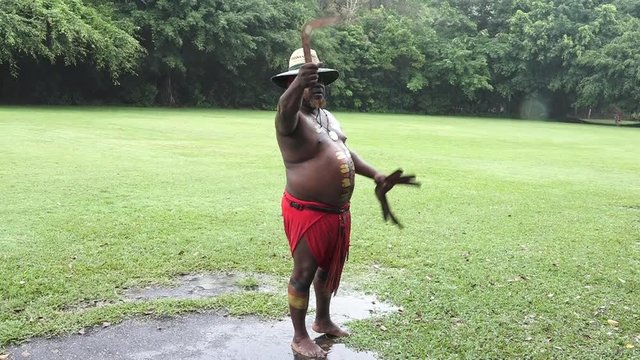 Yirrganydji Aboriginal warrior demonstrates how to throw a boomerang during a cultural show in Queensland, Australia