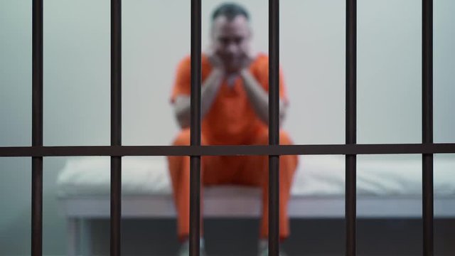 Scene of an inmate in a jail or prison