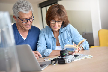 Senior couple preparing vacation trip