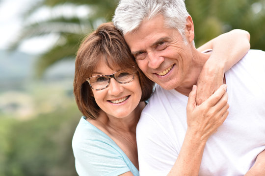 Portrait of happy senior retired couple