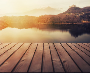 wooden lake boardwalk with beautiful nature background 