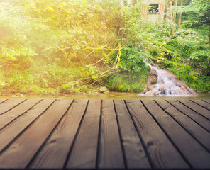 wooden lake boardwalk with beautiful nature background 