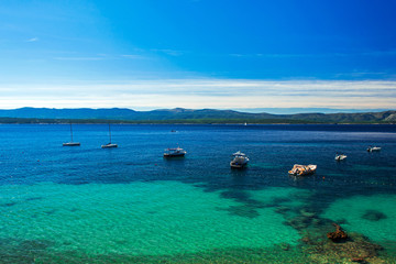 beautiful sea view on crystal water bay with yachts and boats  on island Brac, Croatia