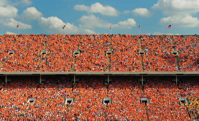 Crowd of thousands dressed in orange - obrazy, fototapety, plakaty