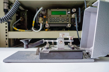 morse key telegraph in front of the radio