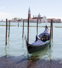 Fototapeta na wymiar Gondola on water in Venice Italy. May 2016