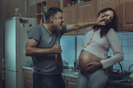 Drunk man hits a pregnant woman.
