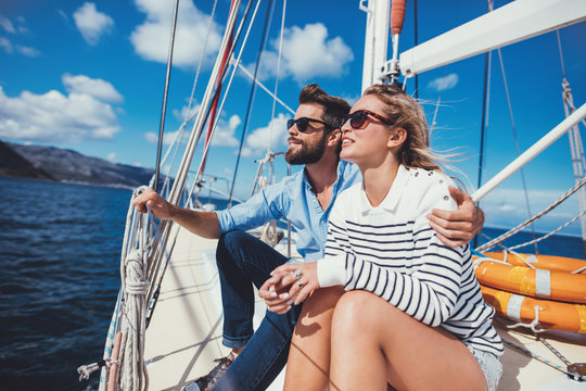  Young couple relaxing on yacht