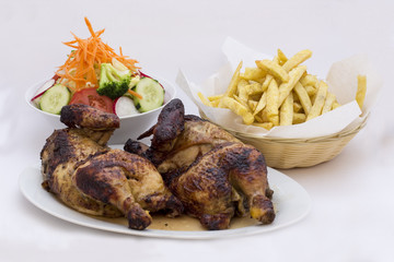 Peru dish: Roasted chicken with fries potato and salad. 