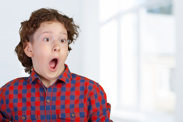 Portrait of young amazed boy