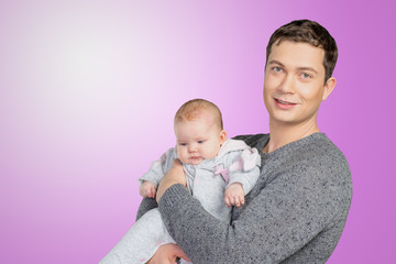 Happy young man holding a  baby