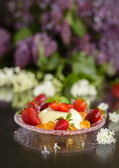 Spring dessert pannacotta with strawberries and flowers