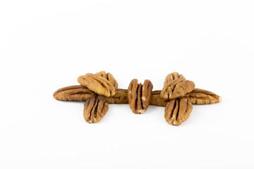 Pecan halves arrangement on a white background