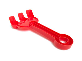 Red fork beach toys isolated on white background. Color toys. Beach toys. Isolated toys.Children toys.