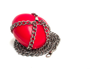 Red heart locked with chain. Love concept. Red heart locked on padlock. Love locked heart shape with chains on white