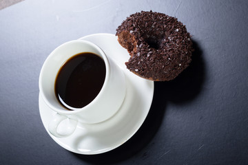 donut and coffee on the black background