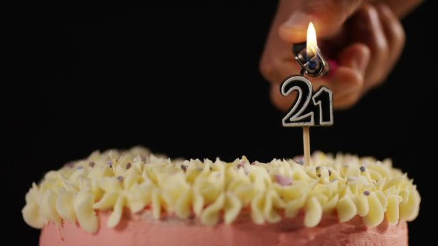 4K Candle for a 21st celebration cake being lit, with space for text