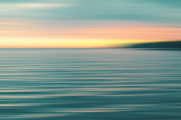 Colorful sunset over sea. Blurred background