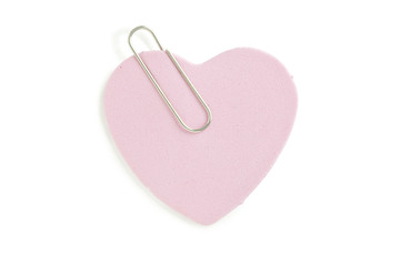 pink heart shaped paper with paper clip