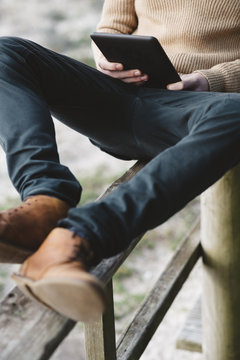 Man sitting using a tablet