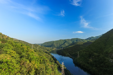 Naklejka na ściany i meble View of mountain river in Kanchanaburi, Thailand