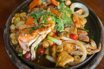sour and sweet seafood fried on hot pan