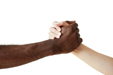 Arm wrestling against racism. Black and white human holding hands in a handshake, showing friendship and respect to each other. Close up shot of African man extending a helping hand to Caucasian woman