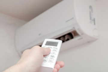 Using air conditioner, remote close up