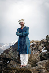 Naklejka premium beard man in national clothes with his arms crossed