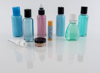 Travel Size Toiletries on Reflective Surface
