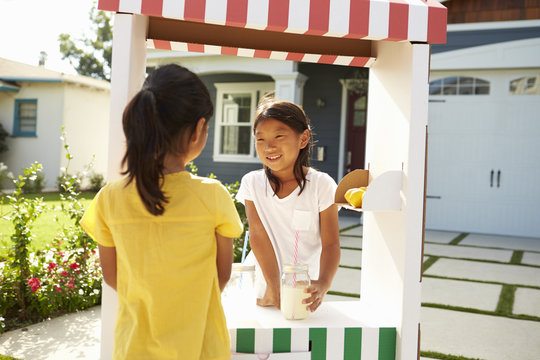 Two Girls At Home Made Lemonade Stall