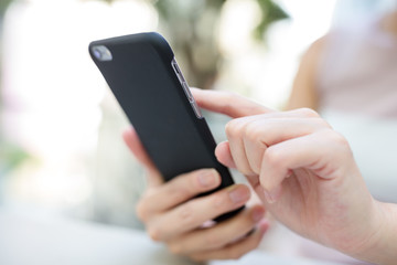 Woman sending sms on phone