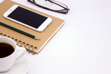 Business work place with cup of coffee on white table