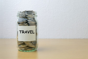 Money saving for travel in the glass bottle