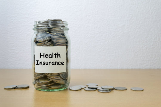 Money saving for health Insurance in the glass bottle