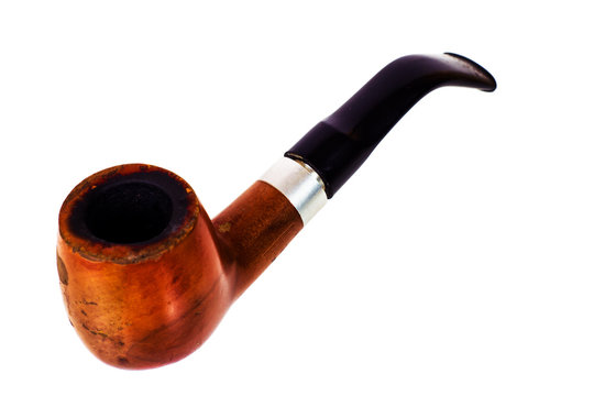 Shabby old tobacco pipe. Isolated on white background.