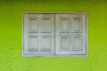 vintage windows on the green wall