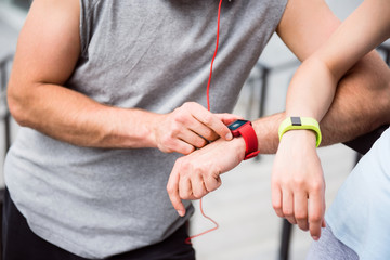 Hands of man and woman with watches