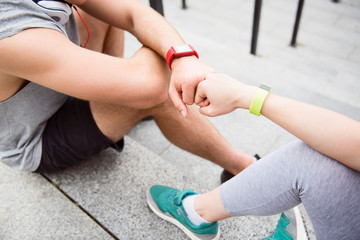 Friends doing gesture of fist bumping