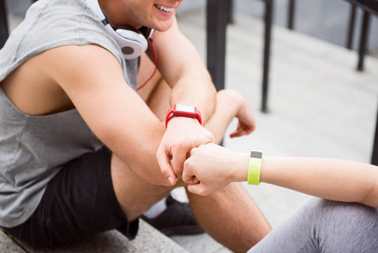 Woman and man sitting together on the stairs