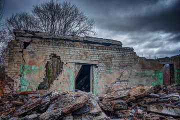 Wall ruined brick house.