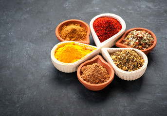 Spices, herbs and spicy spices in bowls