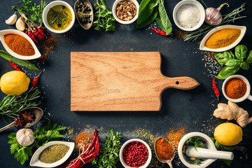 Herbs and spices over black stone background © Alexander Raths