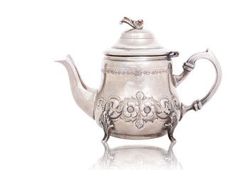 Antique silver teapot isolated on white with a clipping path.