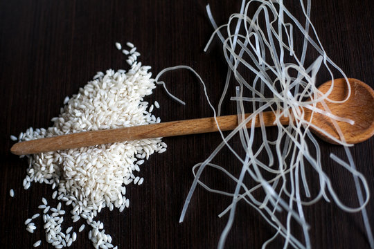 Rice with rice nudles and wooden spoon