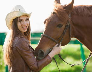 Fototapeta premium Woman and horse. Portrait close up