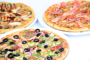 three different kind of pizzas